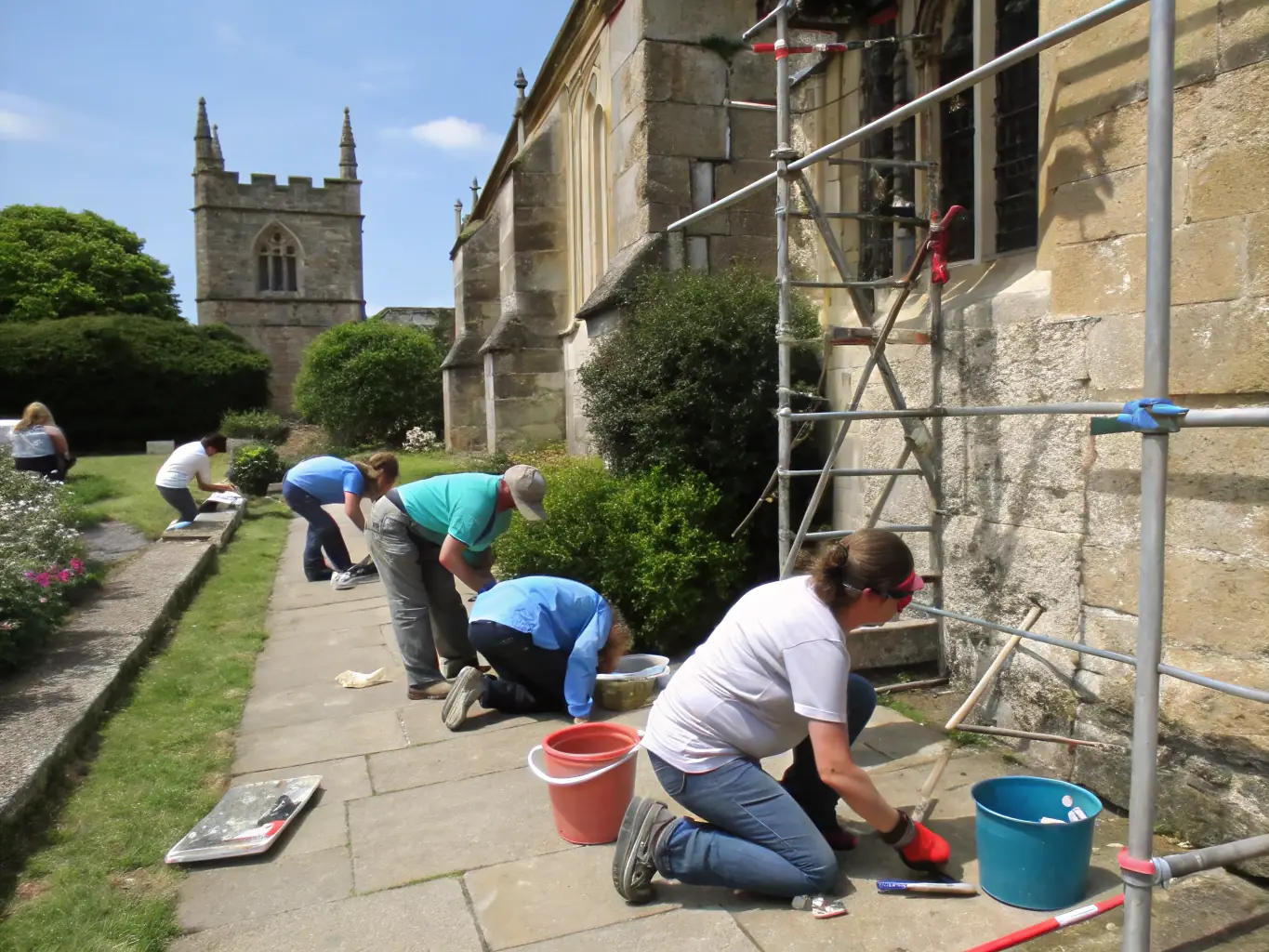 A detailed image of the chapel's stained glass windows undergoing conservation, with experts carefully cleaning and repairing the delicate artwork to restore its vibrant colors.